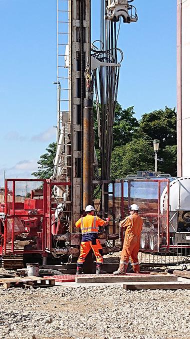 Workmen with the temporary casing on the abstraction well