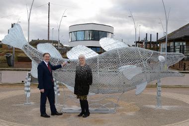 Andy Whittaker, South Tyneside Council's Corporate Lead for Town Centres and Foreshore and Councillor Joan Atkinson with the new Feed the Fish sculpture at Sandhaven Beach in South Shields.