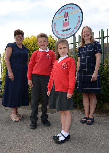 Cllr Carter, with Marsden Primary School headteacher Caroline Marshall, and pupils Sonny Young and Lana-May Wright. 