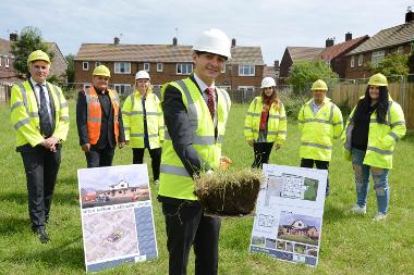 Caption: Cllr Ellison (centre) with Tony Joyce (service manager), Norman Trainer from Surgo Construction, Laura Brennan and Darren Bird, residential mangers for children's services with care experienced young people Ruby Watt and Jasmine Hagan