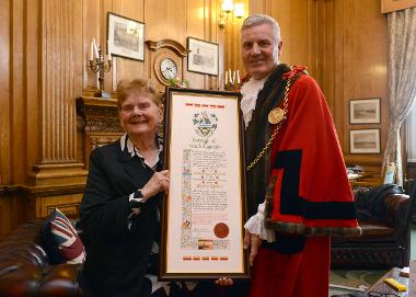 South Shields-born Sheila Graber is pictured with the Mayor of South Tyneside receiving her Freedom Scroll. 