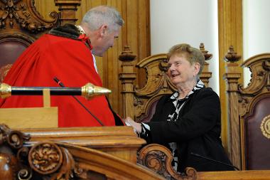 Sheila is handed her Freedom Scroll during the Extraordinary Meeting of Borough Council.