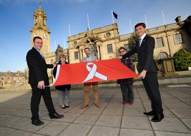 Chief Executive Jonathan Tew, Leader Cllr Tracey Dixon, Director of Public Health, Tom Hall, Cllr Ruth Berkley and Cllr Adam Ellison are pictured with the White Ribbon flag